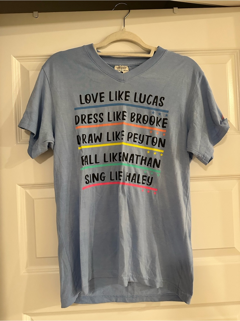 Jadelynn Brooke Light Blue V-Neck Graphic Tee with Rainbow Accents